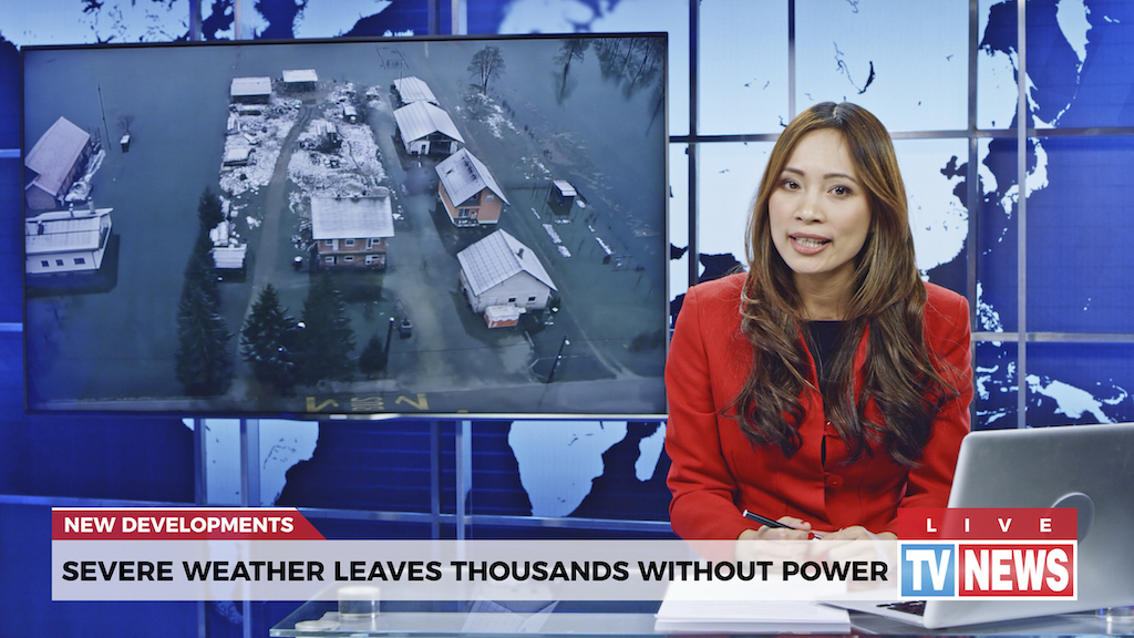 A female newscaster presenting a dangerous power outage, homes in need of whole house generator installation. 