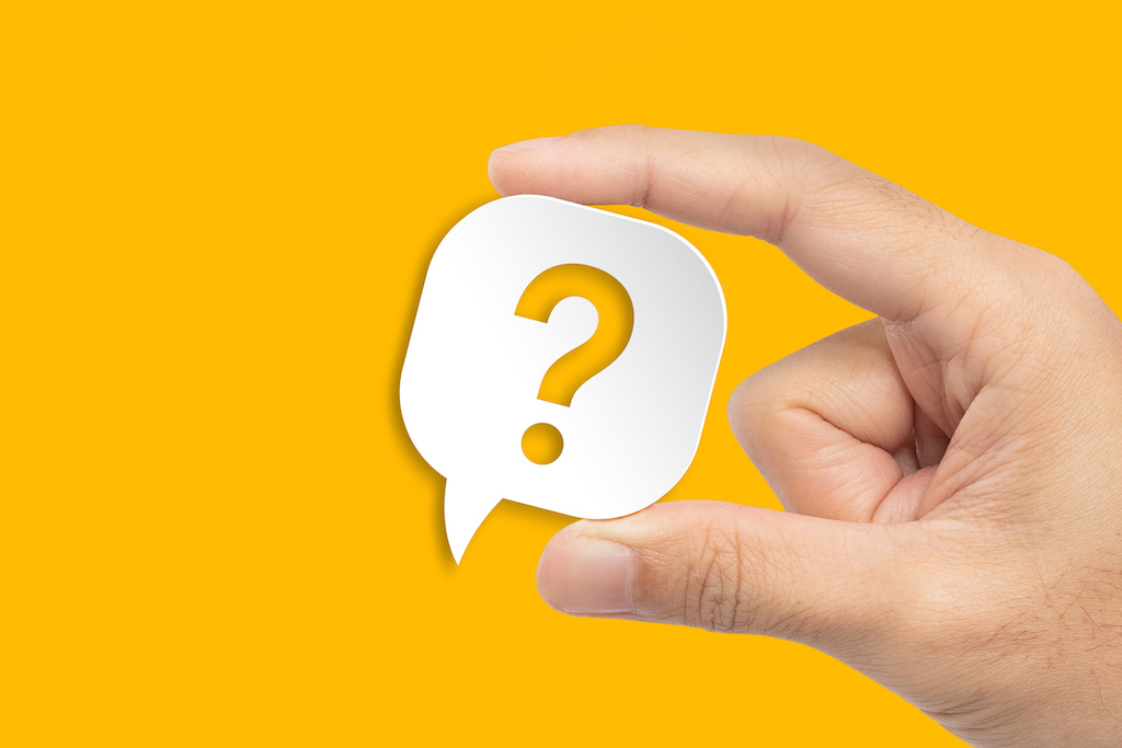Yellow background with FAQ bubble representing FAQs about generator services in Brunswick, NC.