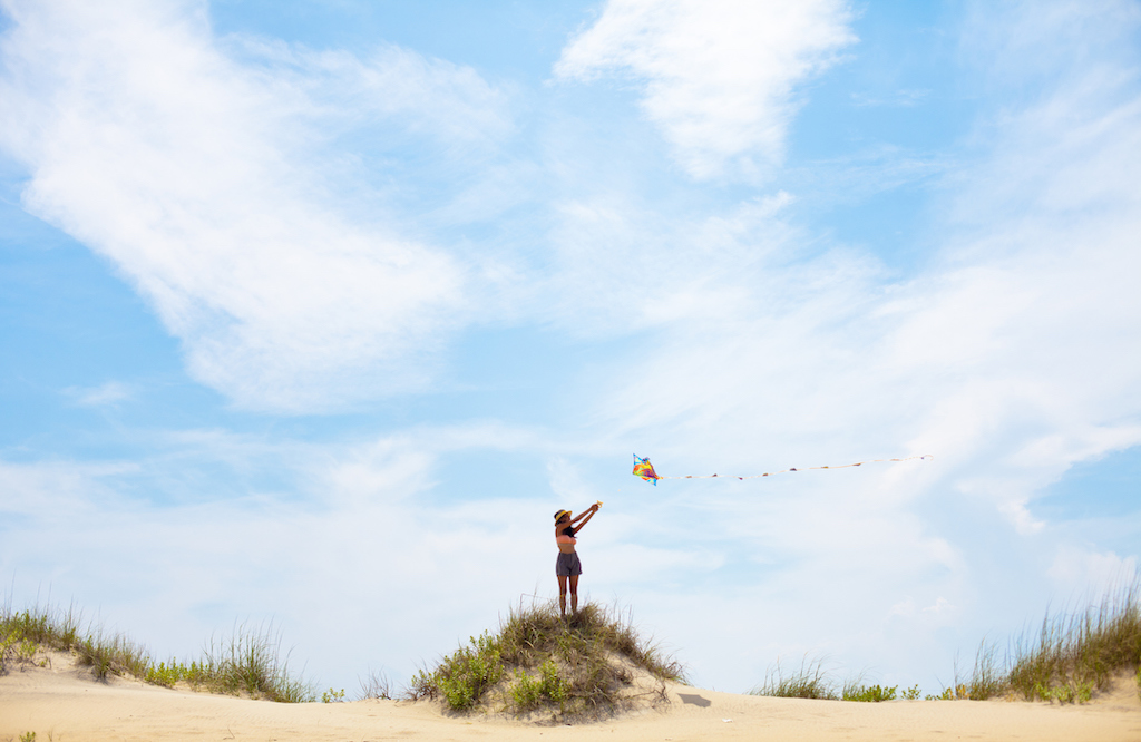 Woman flying kite on North Carolina beach | Generator Services in Carolina Shores, NC